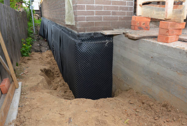 Happy homeowners after waterproofing job in Attalla